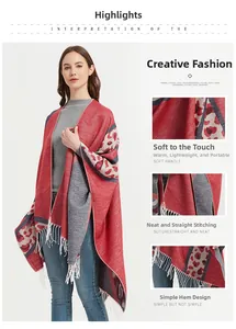 Detail of red and grey leopard pattern shawl with soft knit fabric and long white tassels