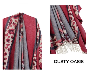 Detail of red and grey leopard print shawl featuring textured knit and fringe trim