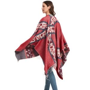 Red knit poncho with blue leopard print and decorative tassels for women fashion