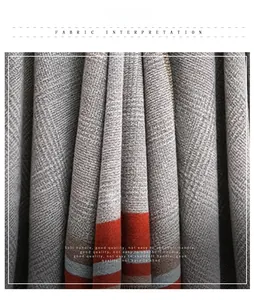 Detailed macro view of soft grey tweed knit fabric with orange stripes texture