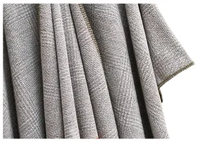 Detailed close-up showing the dense twill knit texture of a thick grey checkered shawl