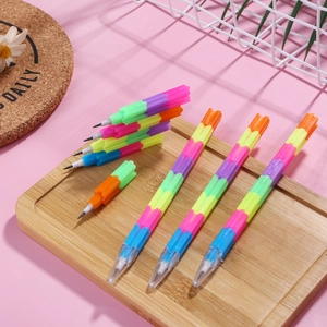 Rainbow building block stackable pencils for students on a pink decorative background