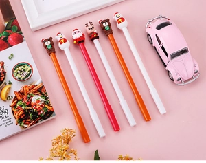 Detailed view of 6 Christmas cartoon pens with 3D Santa, snowman, and reindeer figures
