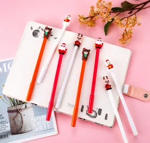 Detailed view of Christmas themed gel pens with 3D Santa, deer and snowman figures