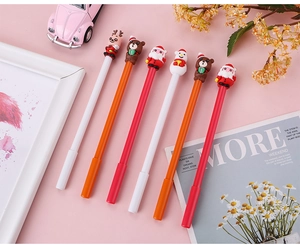 Detailed view of 6-piece Christmas gel pen set with cute silicone Santa and reindeer toppers