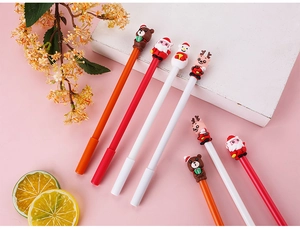 Detailed view of cute Christmas cartoon gel pens with Santa and reindeer toppers