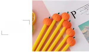 Close-up of creative Halloween pumpkin gel pens on a stylish pink lifestyle background