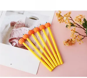 Detail view of 6 creative pumpkin gel pens for Halloween on a white magazine background