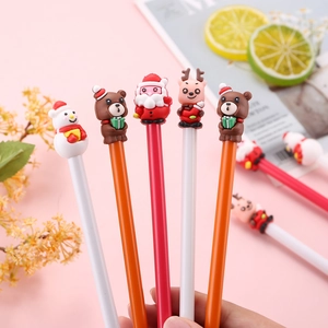Set of 5 Christmas cartoon gel pens with Santa and reindeer toppers on pink background