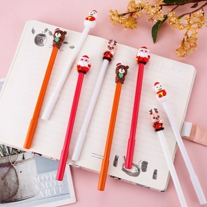 Creative Christmas gel pen set with cute reindeer and snowman silicone toppers on notebook