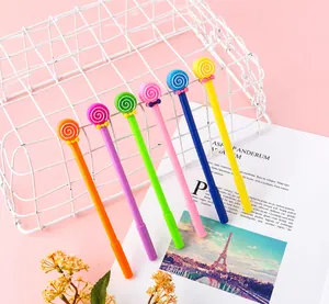 Close-up of six colorful lollipop pens with bow ties in a white wire storage basket