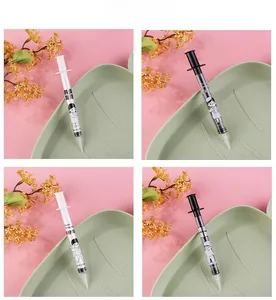 Detail of creative syringe-shaped gel pens featuring cute cartoon illustrations and text