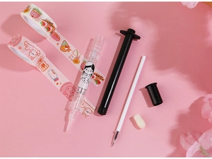 Close-up of pink syringe gel pen set with cartoon decorative washi tapes on flat lay