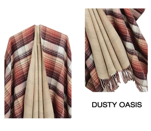 Detail of red-brown plaid shawl featuring classic tartan pattern and soft fringe edges