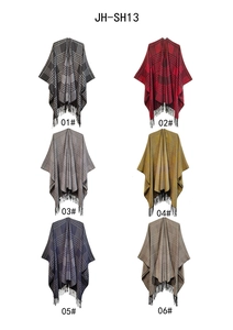 Detailed view of plaid poncho fringe tassels in multiple color patterns for women