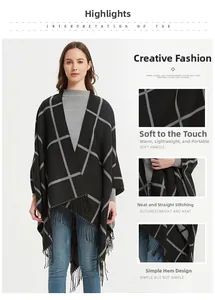 Detalle del poncho de cuadros negros mostrando el tejido suave y el dobladillo con flecos