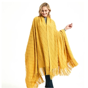 Solid mustard yellow knitted shawl with textured diamond weave and tassel fringe decor