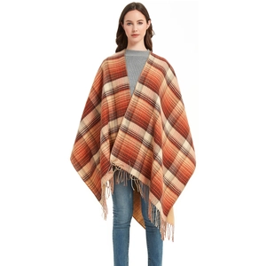 Women's autumn plaid poncho shawl with orange and brown check pattern and tassel fringe