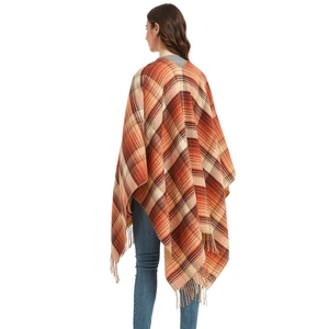 Women's autumn plaid poncho wrap with orange and brown check patterns and fringe hem
