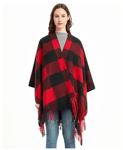Close-up of thick red and black checkered knit shawl with fringe edge detail