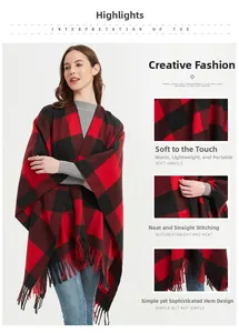 Detail view of thickened red and black plaid shawl with fringes and soft fabric texture