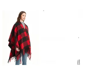 Close-up of red and black buffalo plaid shawl featuring long fringed tassels and soft texture