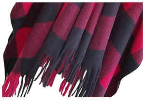 Close-up of red and black buffalo check pattern scarf with soft fringe tassel details