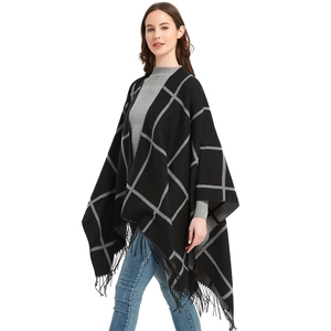 Women's black and grey checkered knit poncho cape with long fringe tassel edges