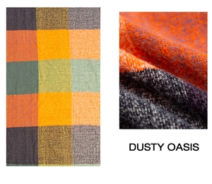 Macro detail of thick woven plaid scarf fabric in warm orange and grey tones