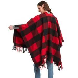Red and black buffalo plaid knitted poncho with fringe tassels and split front design