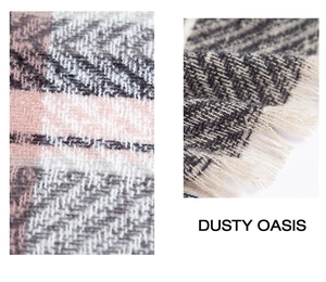 Detail of pink and grey herringbone knit scarf with soft decorative tassel fringes
