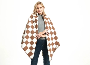 Detail of checkered shawl with delicate stitching and soft cashmere-like texture