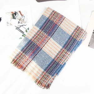Colorful plaid bouclé scarf for women with blue and orange check pattern and frayed edges