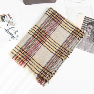 Plaid bouclé scarf for women with tassels in beige, orange, and black patterns