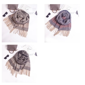 Flat lay of soft striped scarves with fringe details, styled with trendy accessories