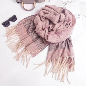 Macro detail of soft striped pink-purple scarf with long tassels and rose styling