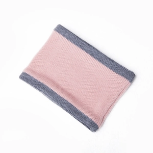 Close-up of pink and grey color-block knitted neck warmer with thick ribbed texture