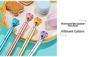 Detail of creative gem-topped pens in pastel colors with large sparkling diamond crystals