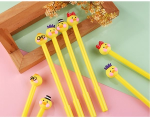 Detail showing cute duck-shaped gel pens with tiny glasses and crown accessories