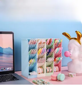 Macro detail of a 4-tier slanted pastel desktop organizer for pens and stationery