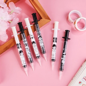 Creative syringe shaped gel pens with cute cartoon illustrations on pink background