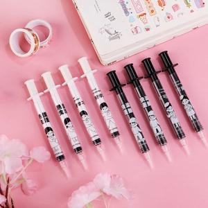 Creative syringe shaped gel pens with motivational quotes on a pink aesthetic background