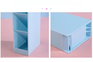 Close-up of matte blue desk organizer showing diagonal slots and textured grain finish