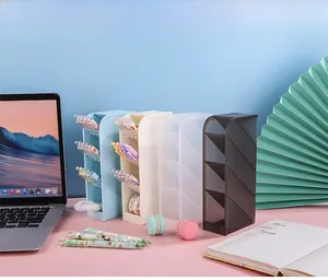 Close-up of a 4-tier slanted desk organizer for pens in blue, white, and frosted black