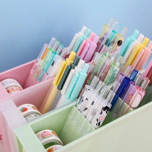 Multifunctional desk organizer with pink and green pen holders and stationery set