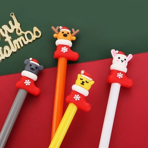 Set of four creative Christmas themed pens with cute animal figures in holiday socks