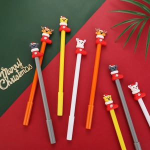 Detail of Christmas themed gel pens featuring cartoon animals in festive red stockings