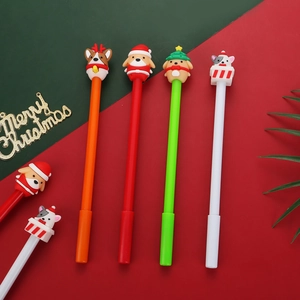 Close-up of Christmas gel pens featuring cute 3D cartoon animal toppers in festive colors