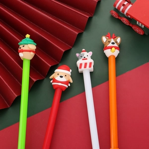 Close-up of cute 3D Christmas character toppers on colorful silicone pens for holiday gifts