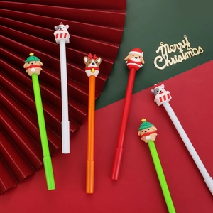 Close-up of creative 3D silicone Christmas dog toppers on smooth writing gel pens